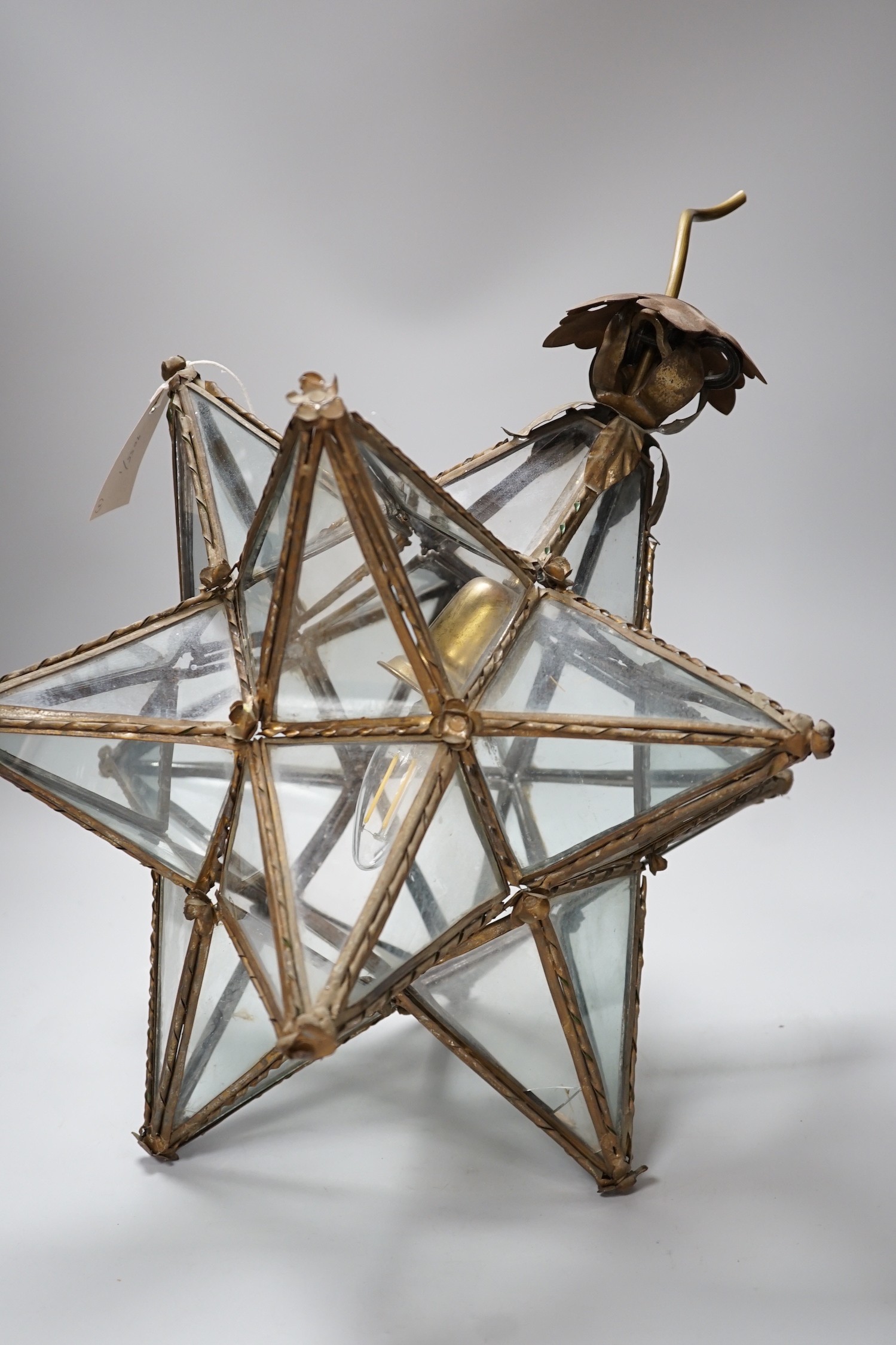 A cut glass four branch electrolier, star shaped gilt metal ceiling shade and a 1970's perspex ceiling shade